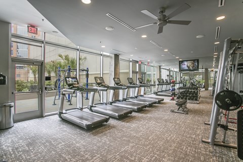 Fitness center with cardio and strength equipment at Glass House Dallas, Texas