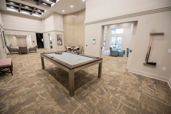 Billiards Room with High-Top Seating and Large Flat Screen TVs
