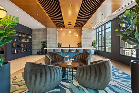 A modern living room with a large sofa and a coffee table.