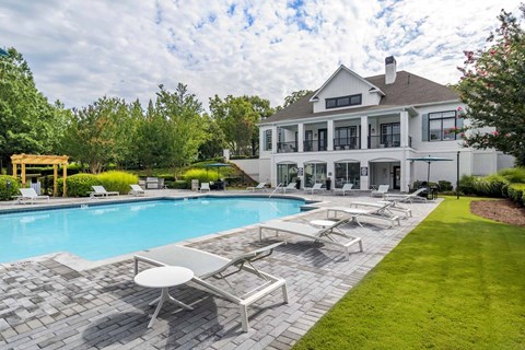 Resort-style swimming pool with lounge seating at Windsor Kennesaw, 1925 Old 41 Highway NW, Kennesaw, GA 30152