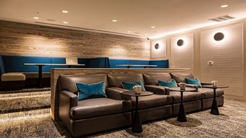 Media room with seating at The Ridgewood by Windsor, Fairfax, VA