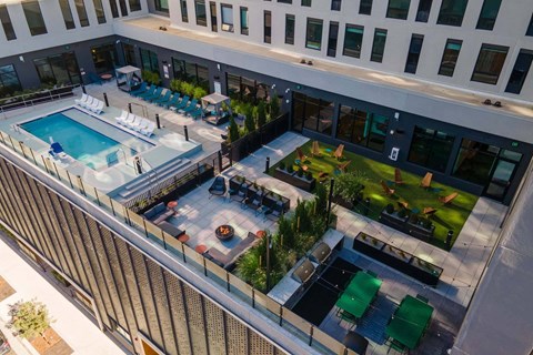 A patio with a pool and lounge chairs at Windsor 3000 Huron, 3000. N. Huron Street, Denver, CO 80202.