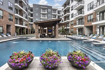 In water lounge chairs at Windsor Fitzhugh, TX, 75206