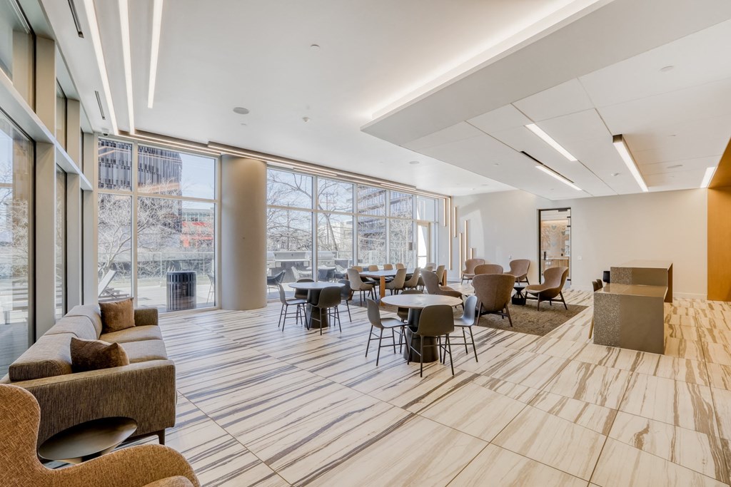 a room filled with furniture and a large window