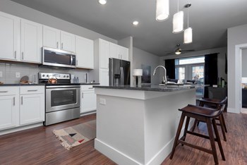 Open concept kitchens feature Whirlpool stainless steel appliances Open concept kitchens feature Whirlpool stainless steel appliances at Windsor Castle Hills, Carrollton - Photo Gallery 5