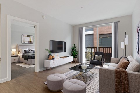 an apartment living room with a couch and a tv