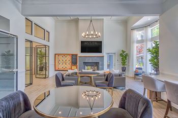 a living room filled with furniture and a large window