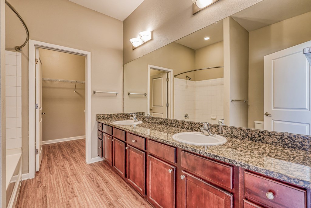 A bathroom with a sink and a mirror at The District, Denver, CO