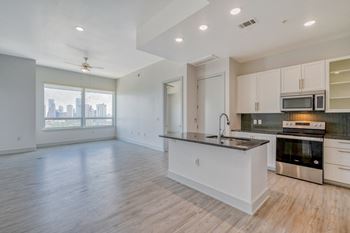 a kitchen and living room in an apartment
