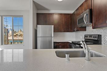 Full kitchen with stainless steel appliances at Allegro at Jack London Square in Oakland, CA
