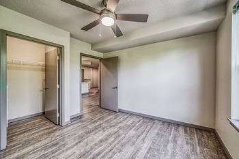 a living room with a ceiling fan
