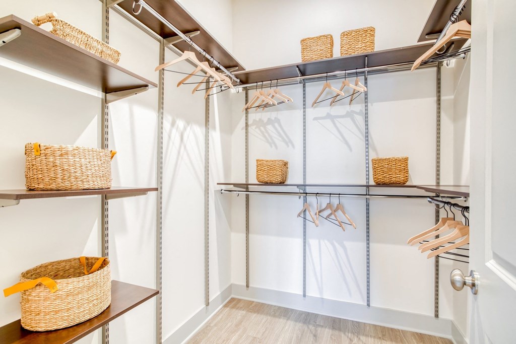 Walk-in closets feature adjustable freedom Rail closet systems at Windsor Mystic River, Massachusetts