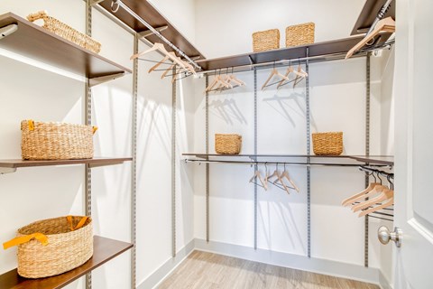 Walk-in closets feature adjustable freedom Rail closet systems at Windsor Mystic River, Massachusetts