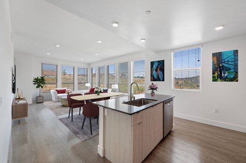 An open kitchen and living room at Windsor Rancho PQ in San Diego, CA, 92129
