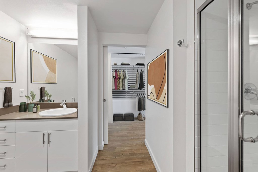 A bathroom with a sink and a mirror.