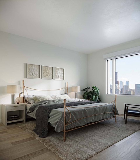 A bedroom with a large bed and a view of the city.