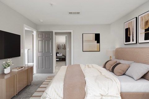 Bedroom with bed, dresser, and wall-mounted TV at Windsor Kennesaw, 1925 Old 41 Highway Northwest, Kennesaw, GA 30152