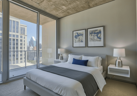 Spacious bedroom with large windows at Glass House Dallas, Texas