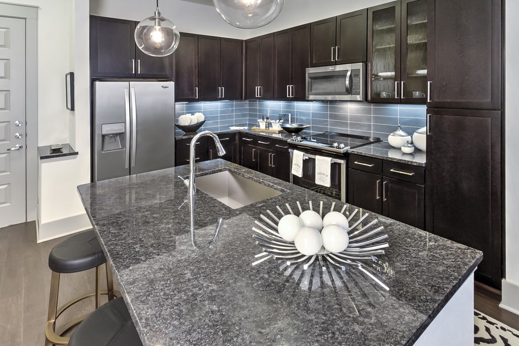 Kitchen island with breakfast bar Kitchen island with breakfast bar at Windsor Fitzhugh, 4926 Mission Avenue, Dallas