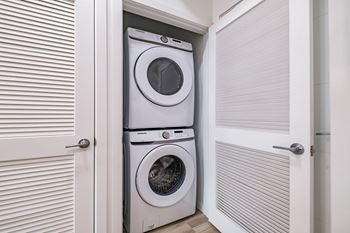 Washer and dryer in a laundry room  at Windsor Ludlam Trail in Miami, FL.