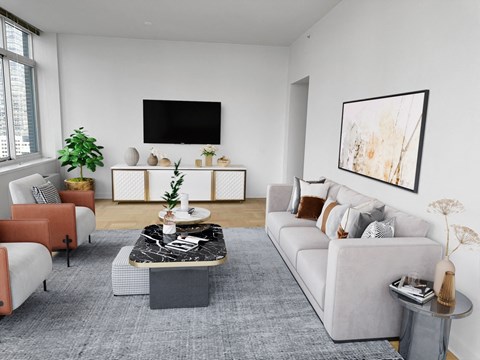 a living room with a couch and a coffee table and a television