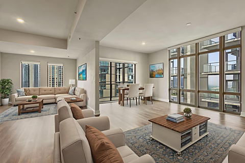 A modern living room with a large couch and a coffee table.