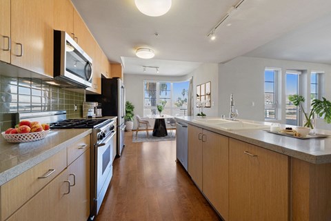 a large kitchen with wooden cabinets and stainless steel appliances