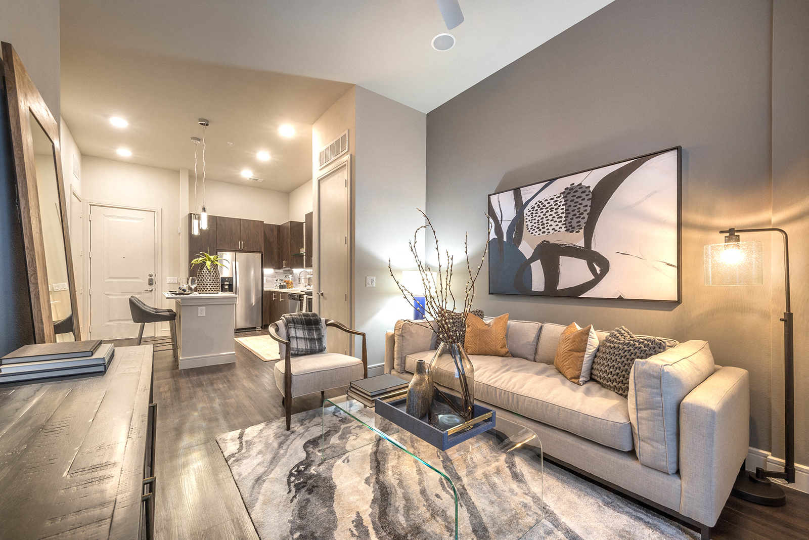 a living room with a couch and a glass table