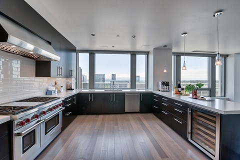 A modern kitchen with a view of the city.