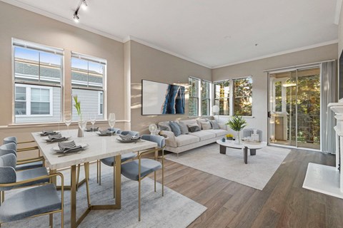 a living room with a dining room table and a couch