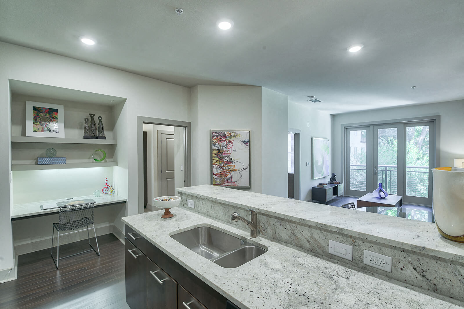 a kitchen with granite counter tops and a sink