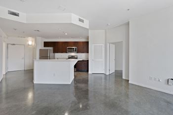 a kitchen and living room in a 555 waverly unit