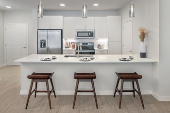 Stunning kitchens feature quartz countertops and subway tile backsplash Stunning kitchens feature quartz countertops and subway tile backsplash at Windsor South Congress, Austin, 78745 - Photo Gallery 3
