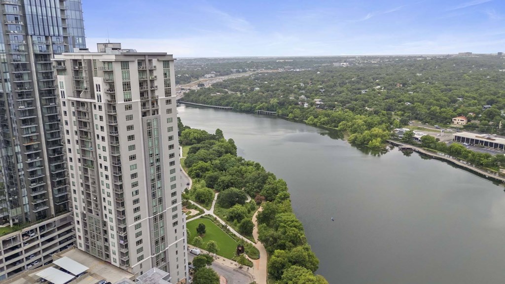 Building exterior and river view at Windsor on the Lake, 43 Rainey Street Austin, TX 78701