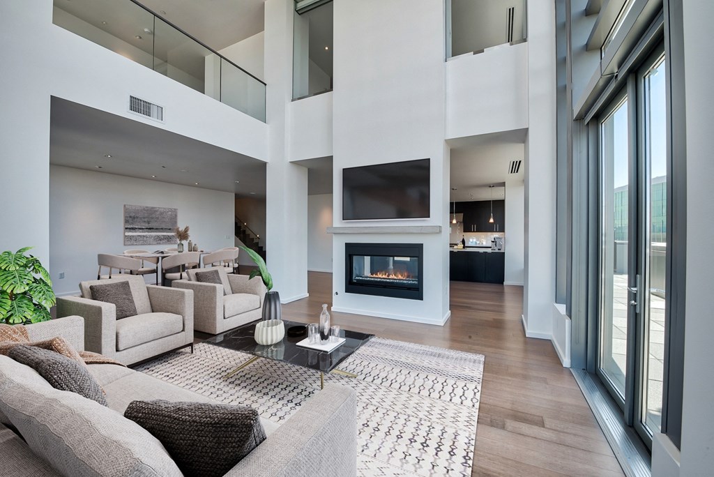 Living room with a fireplace Living room unit S3102 at The Bravern, Bellevue, Washington