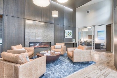 a living room with couches and a fireplace