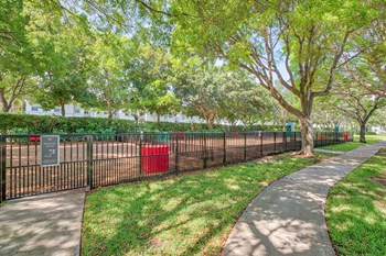 Large fenced in dog park in a shady tree area - Photo Gallery 27