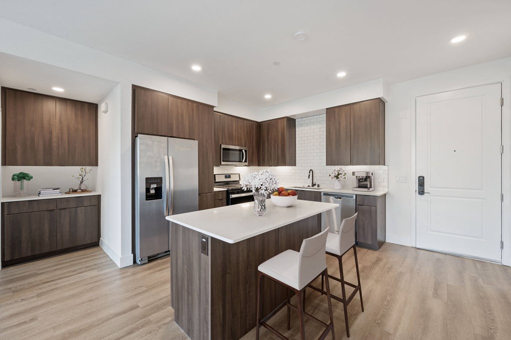 Stunning kitchens feature quartz countertops and backsplash at Windsor Rancho PQ in San Diego, California Stunning kitchens feature quartz countertops and backsplash at Windsor Rancho PQ in San Diego, California