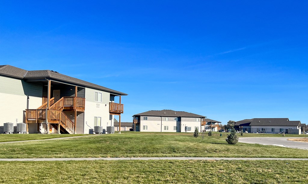 a group of houses on the side of a field