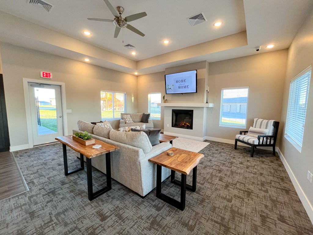 a large living room with a couch and a tv
