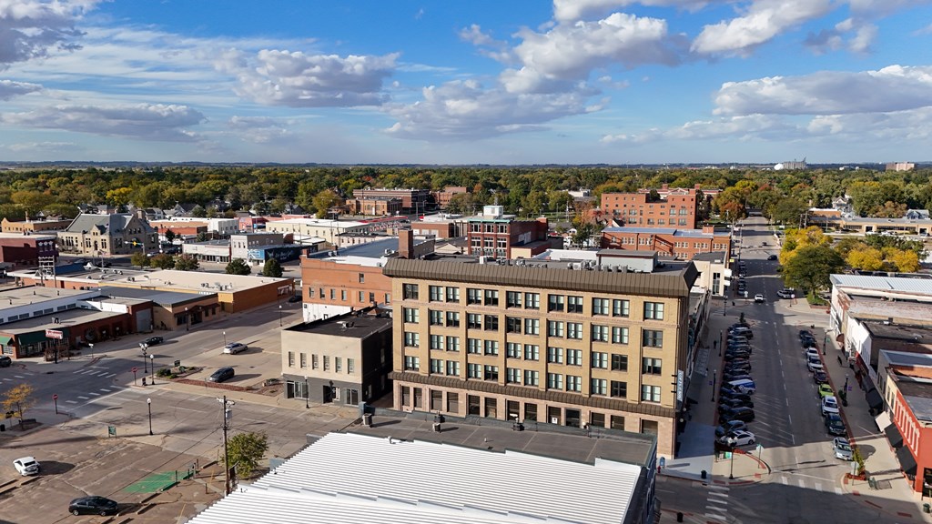 A cityscape with buildings and cars.