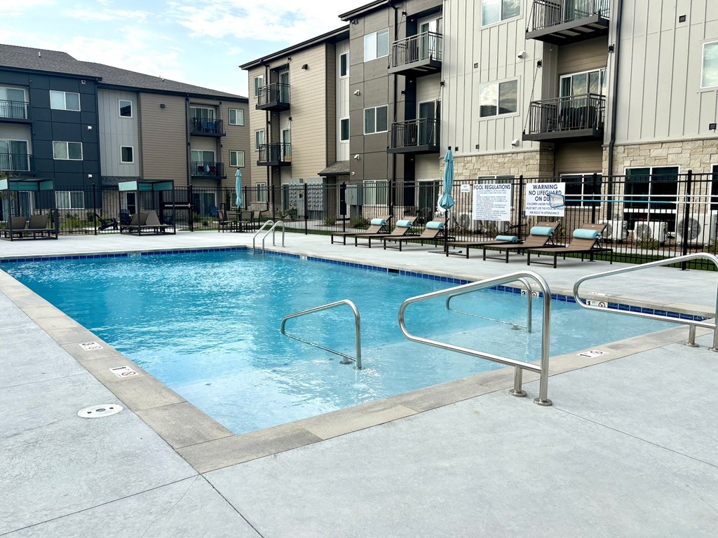 a swimming pool in the middle of an apartment building