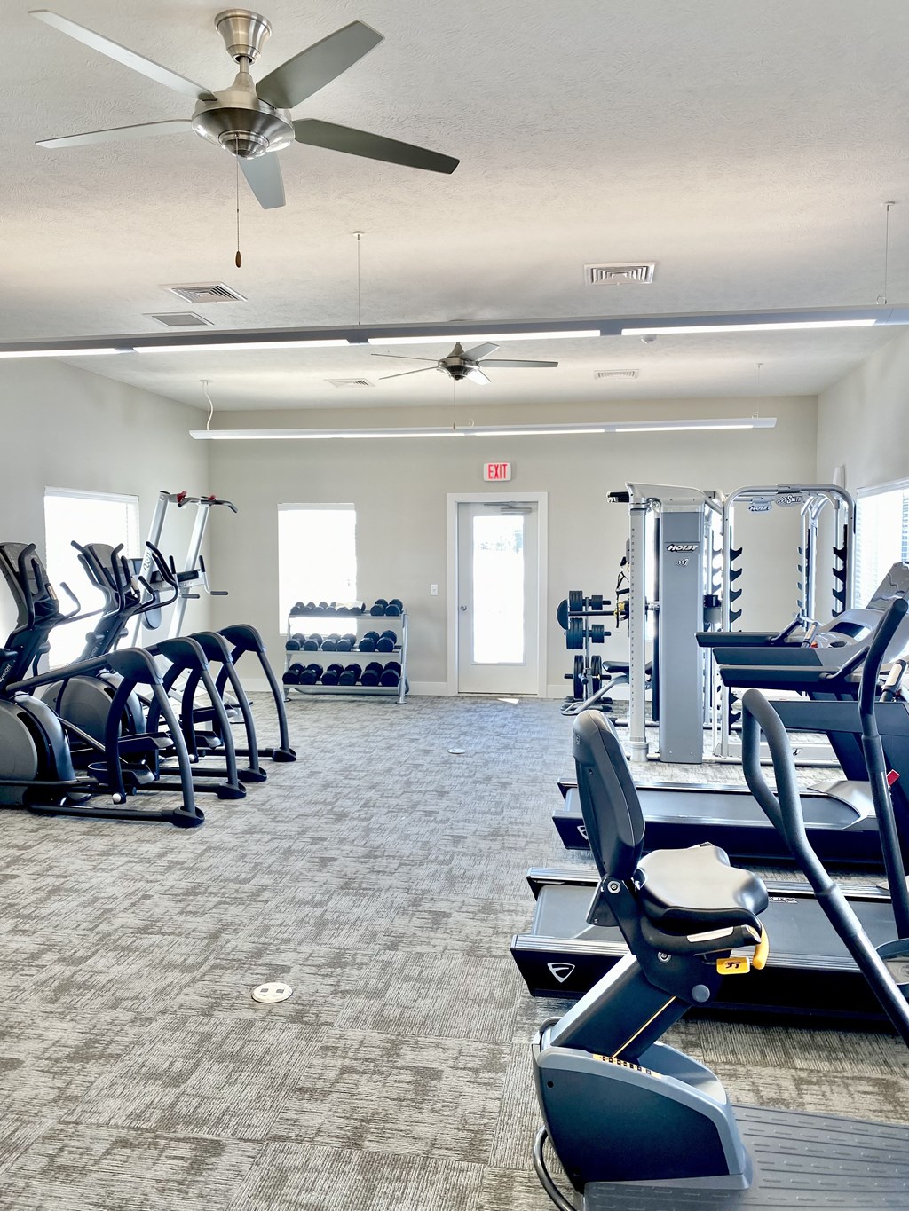 a fitness center with cardio equipment and exercise machines