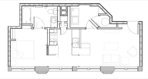 A floor plan of a house with a kitchen, living room, and two bedrooms.