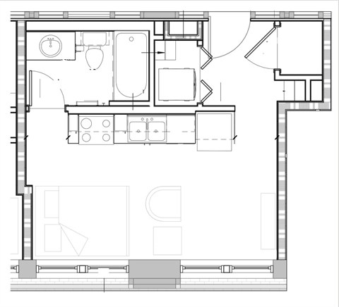 A floor plan of a house with a kitchen, living room, and bathroom.