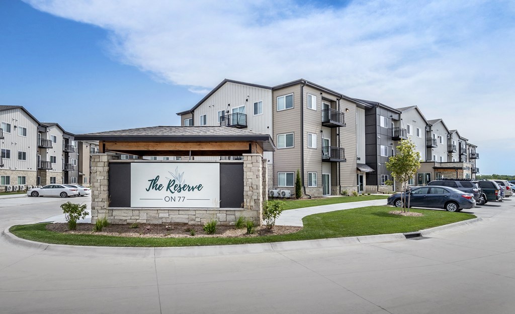 The Reserve ON77 is a modern apartment complex with a clean and well-maintained exterior.