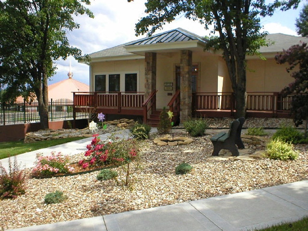 The exterior of the Cedar Ridge Apartments clubhouse with a welcoming entrance.
