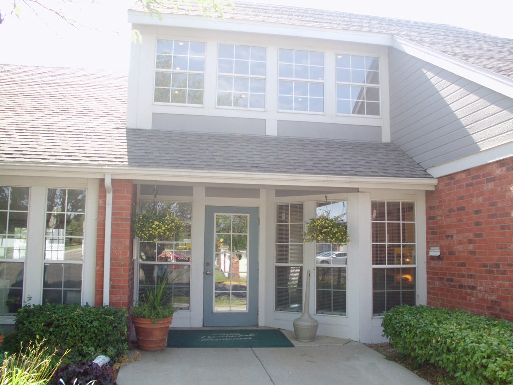 The Northpark Apartments clubhouse exterior with a pathway leading to the entrance.