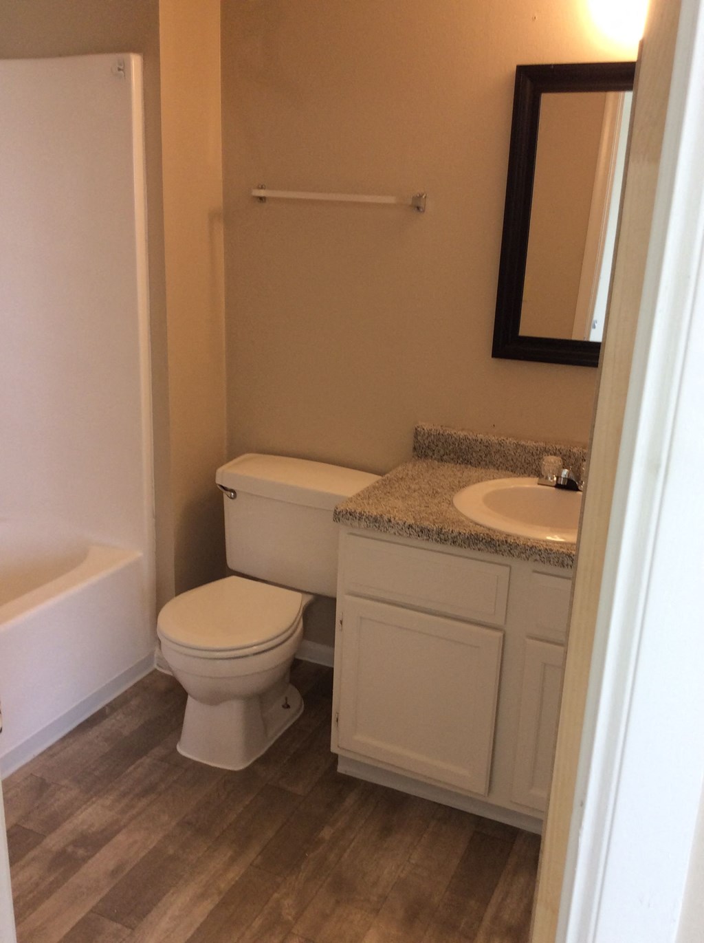 Lower bathroom in the Yeakel Townhome, featuring functional fixtures and a clean design.