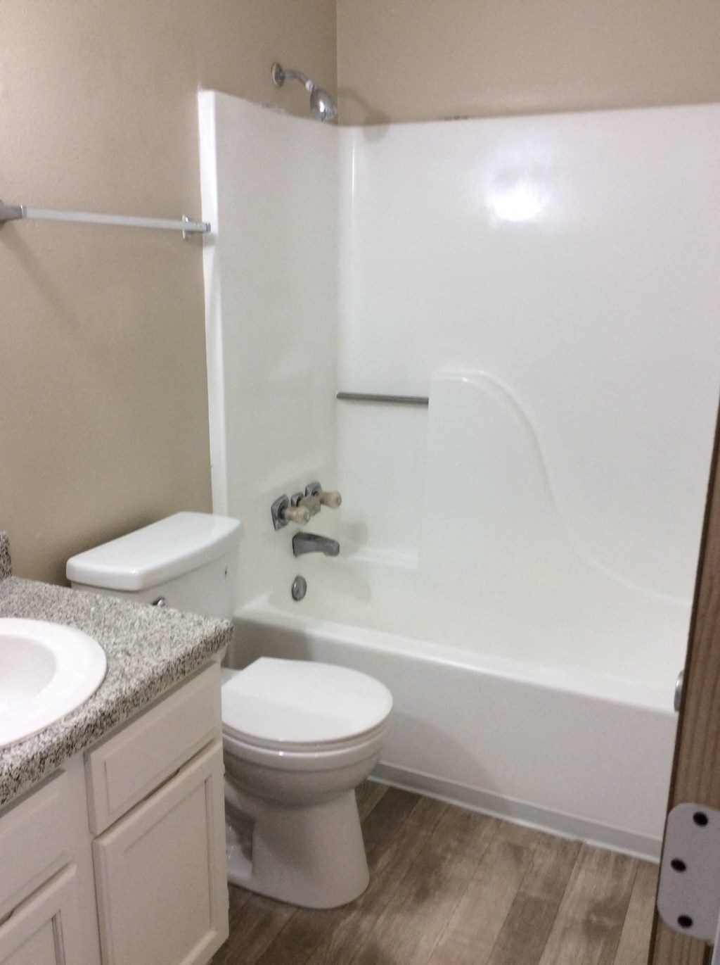 Bathroom in the Yeakel Townhome, featuring a white toilet and a sink.